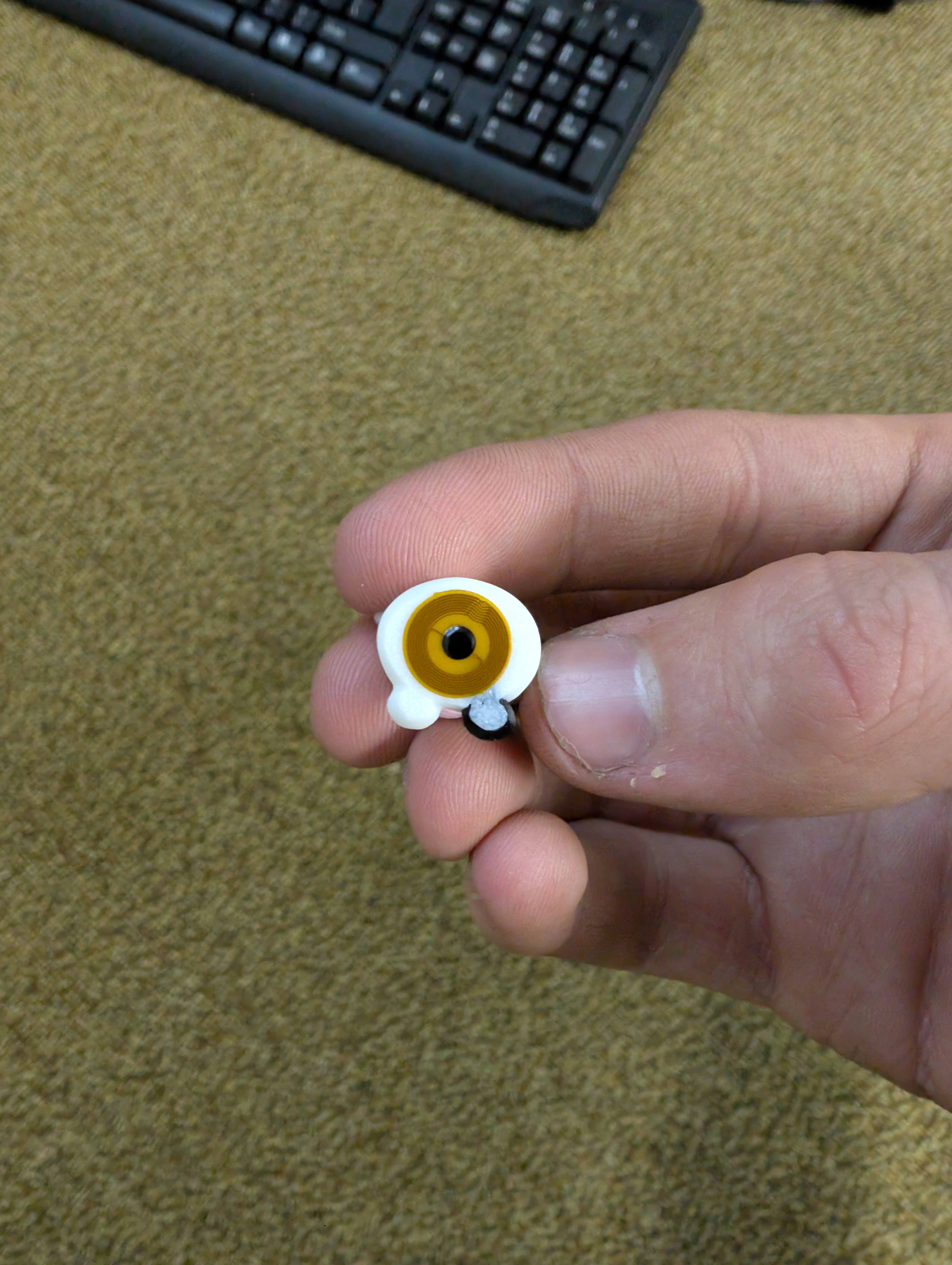NFC tag attached to the bottom of a collectible cow